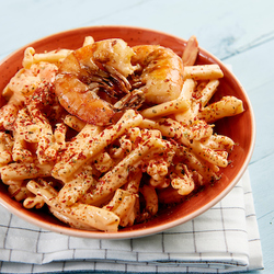 Caserece met scampi en roze pepersaus